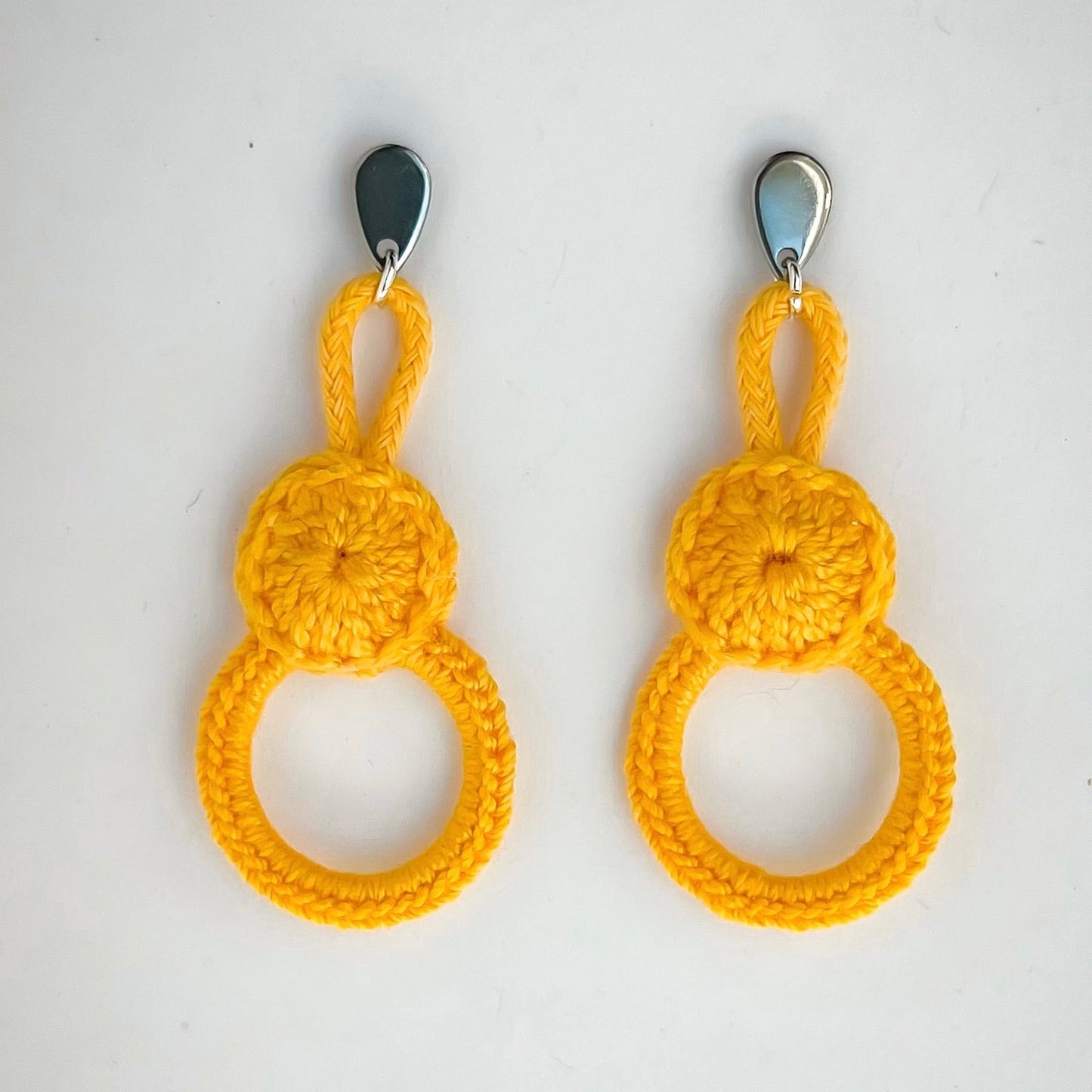 Handmade Gold Dust crochet earrings with double circle design.