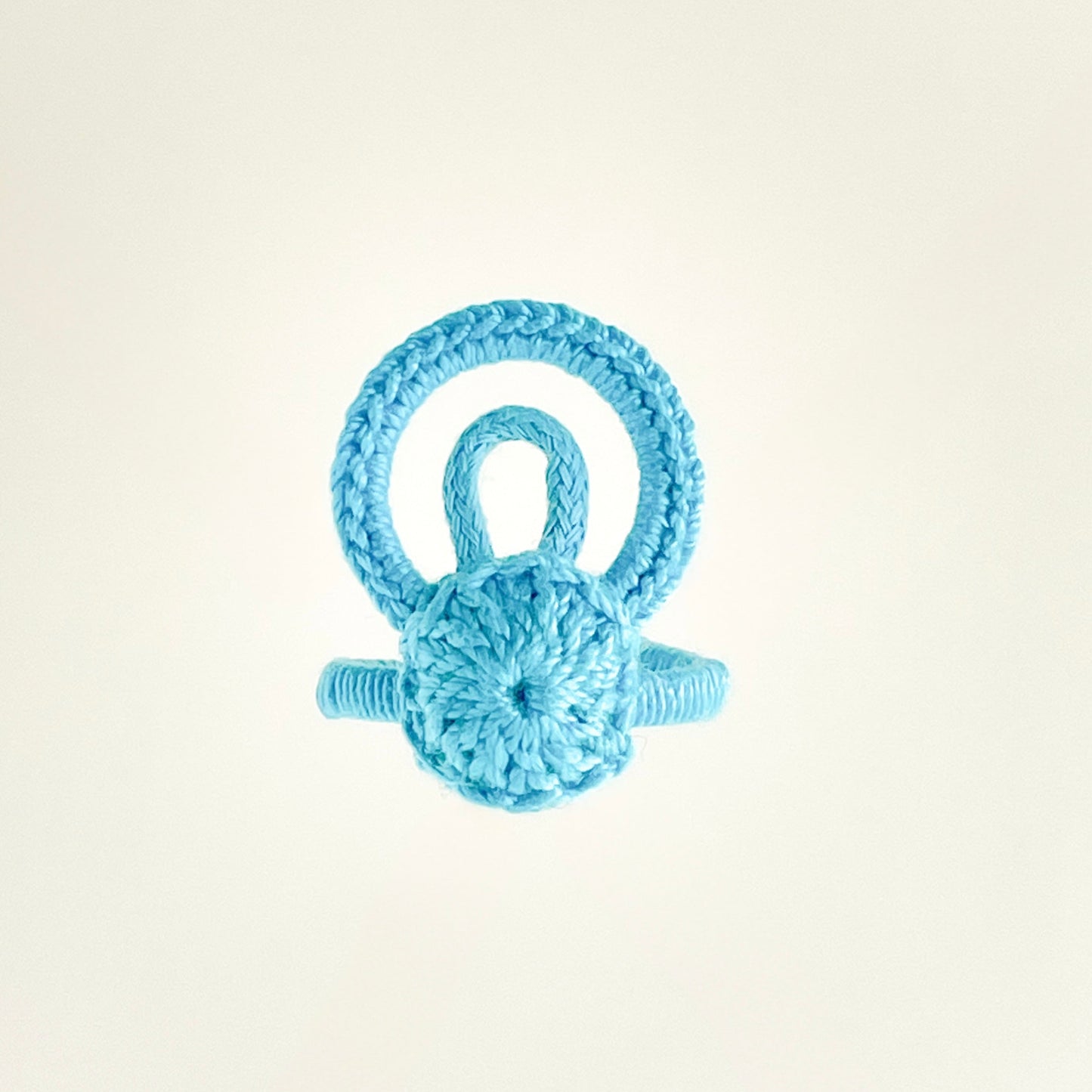 Handcrafted Caribbean blue crochet ring, modern crochet jewelry handmade in Chicago, top view.