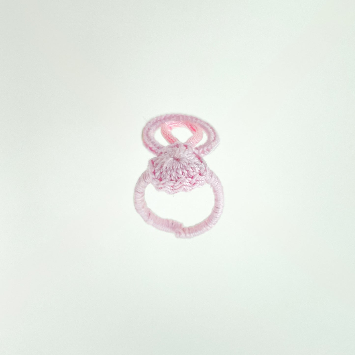 Front-facing view of the Blossom crochet ring in rose, featuring its elegant handmade design and comfortable fit.