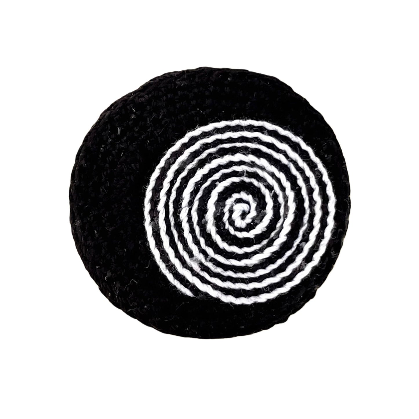 Handmade crochet Spiralis Pin in black with black and white spiral detail, front view on white background.