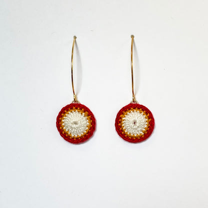 A beautiful pair of earrings made with red and white crochet technique. Delicate and stylish accessory for any occasion.