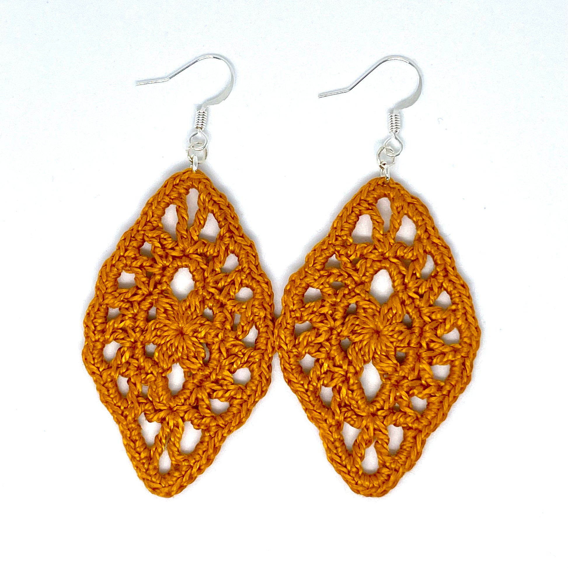 Handmade honey color crochet lace earrings with silver accents, adding a touch of elegance to any outfit. French hook ear wire.