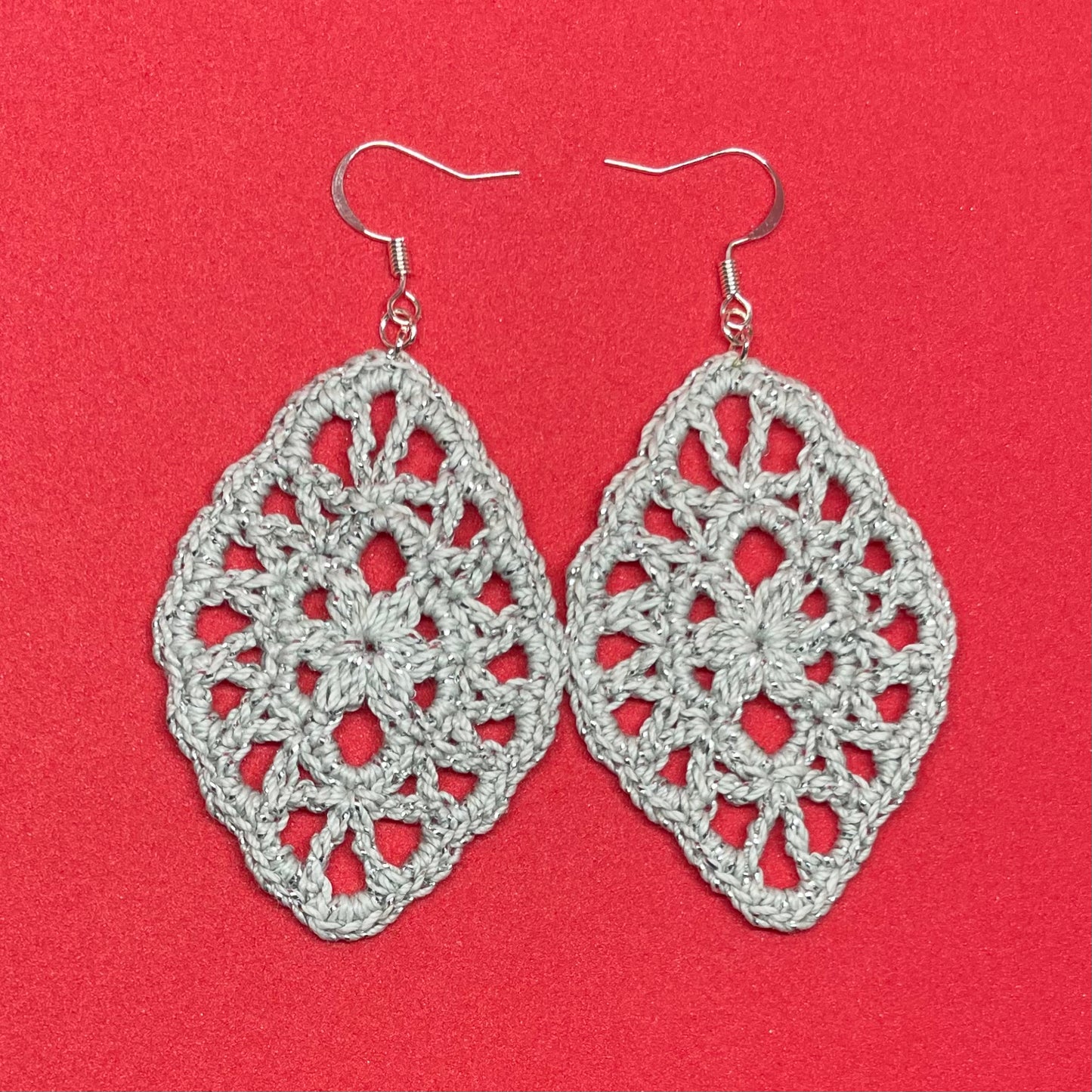 Handmade silver color crochet lace earrings with silver accents, adding a touch of elegance to any outfit. French hook ear wire.