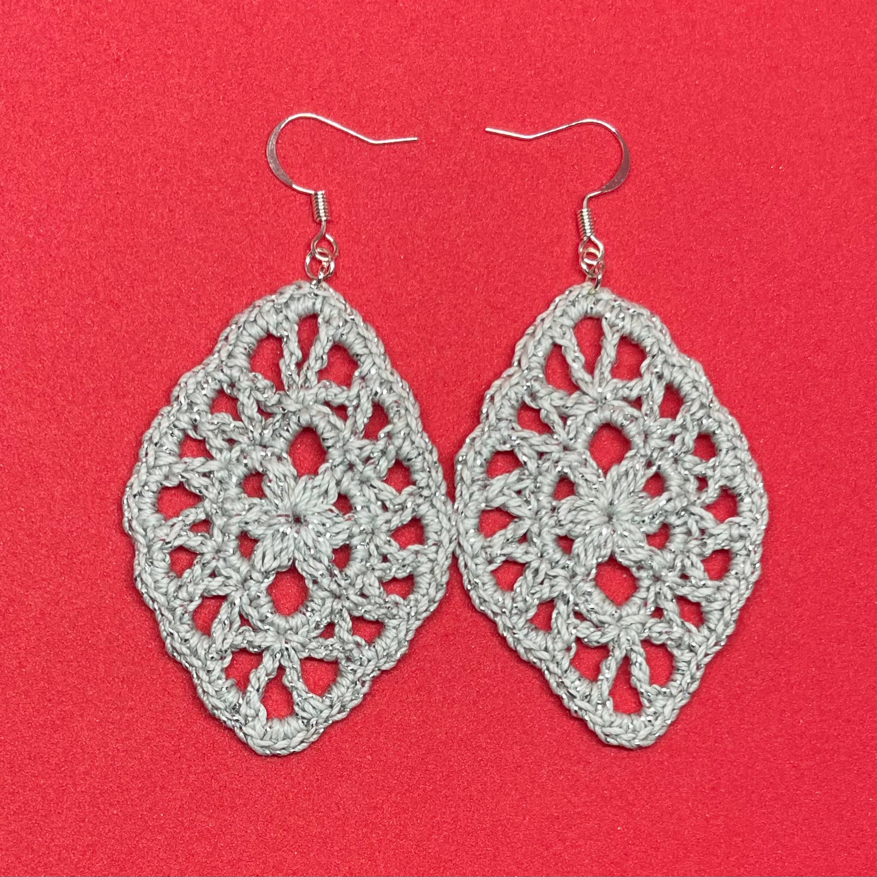 Handmade silver color crochet lace earrings with silver accents, adding a touch of elegance to any outfit. French hook ear wire.