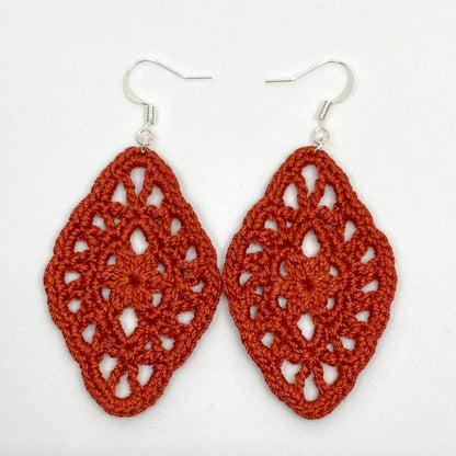 Handmade copper color crochet lace earrings with silver accents, adding a touch of elegance to any outfit. French hook ear wire.