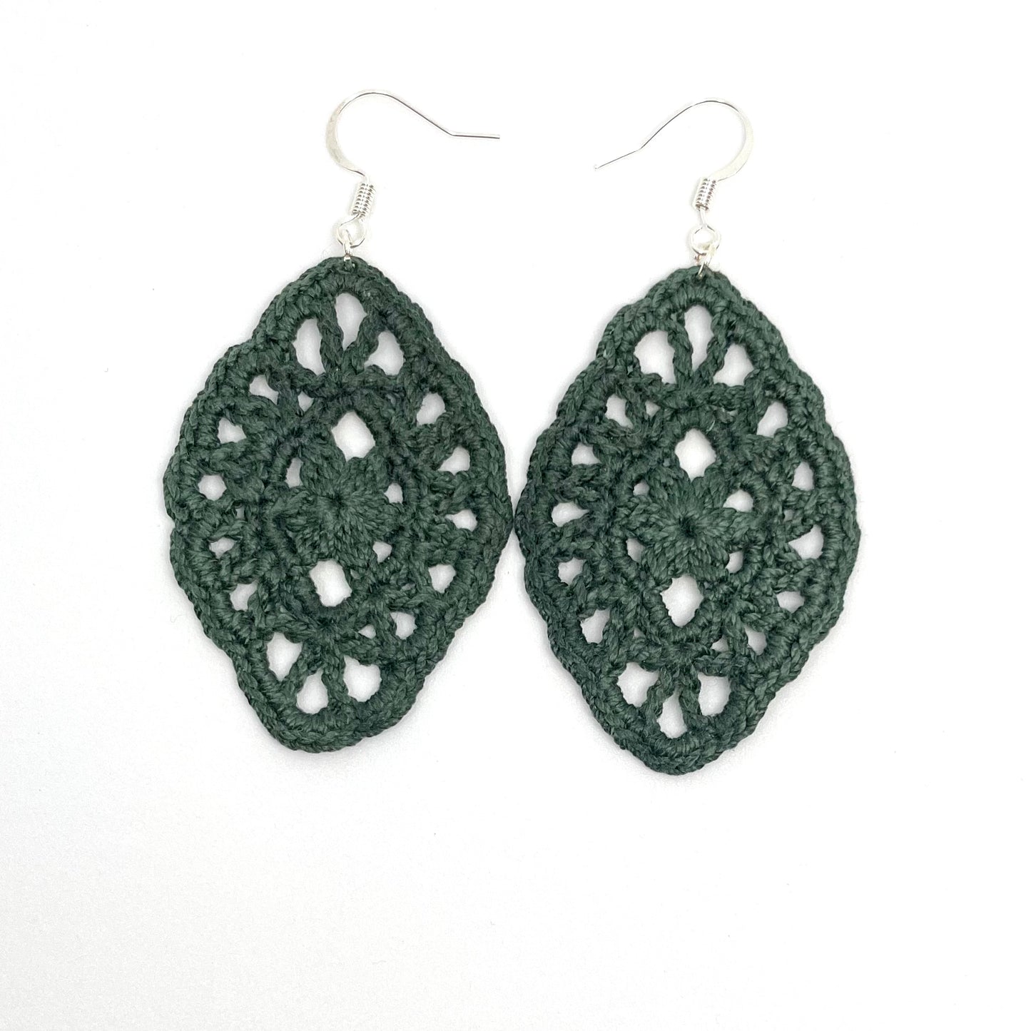 Handmade green color crochet lace earrings with silver accents, adding a touch of elegance to any outfit. French hook ear wire.