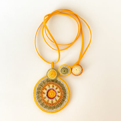 Backside view of the handmade crochet necklace, showcasing neat, detailed finishing and high-quality fiber work in tropical colors.