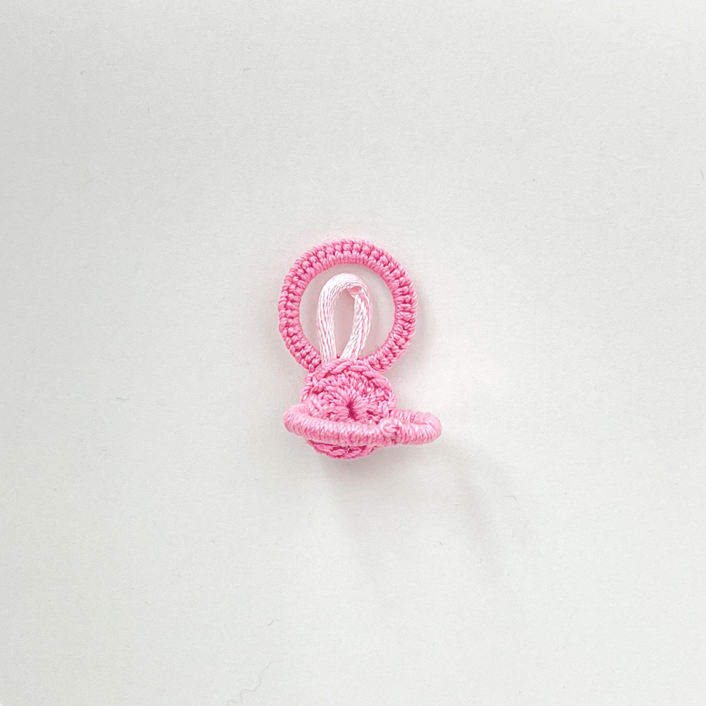 Back view of the light pink crochet ring from the Blossom collection, showing the soft and flexible handmade band structure.