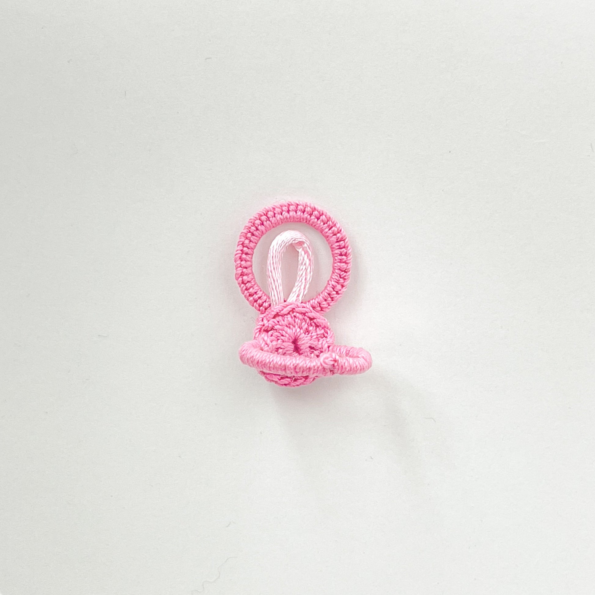 Back view of the light pink crochet ring from the Blossom collection, showing the soft and flexible handmade band structure.