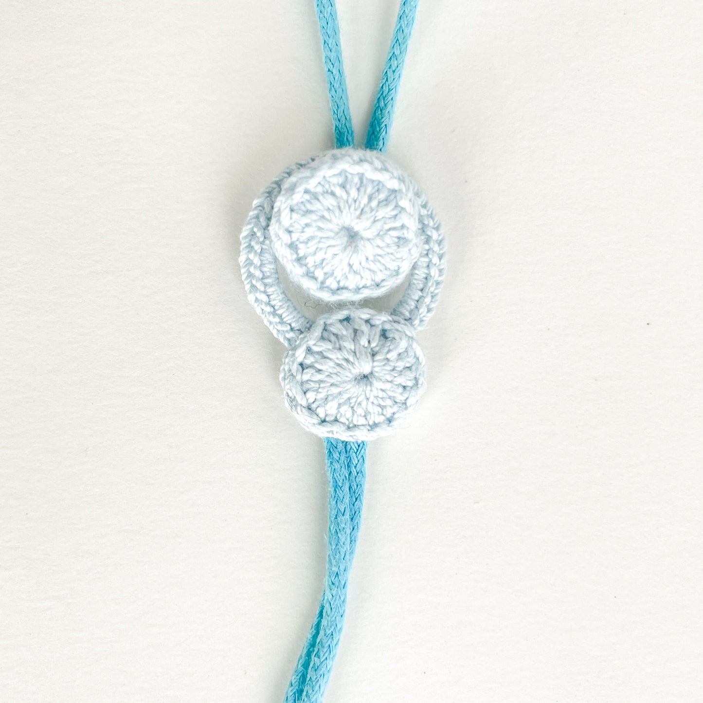 Blossom collection necklace fully closed, with the crochet button secured inside the loop.