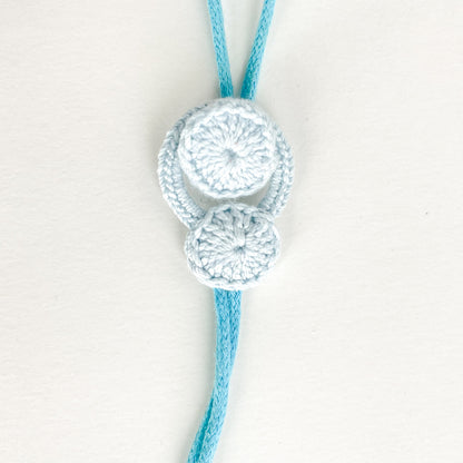 Blossom collection necklace fully closed, with the crochet button secured inside the loop.