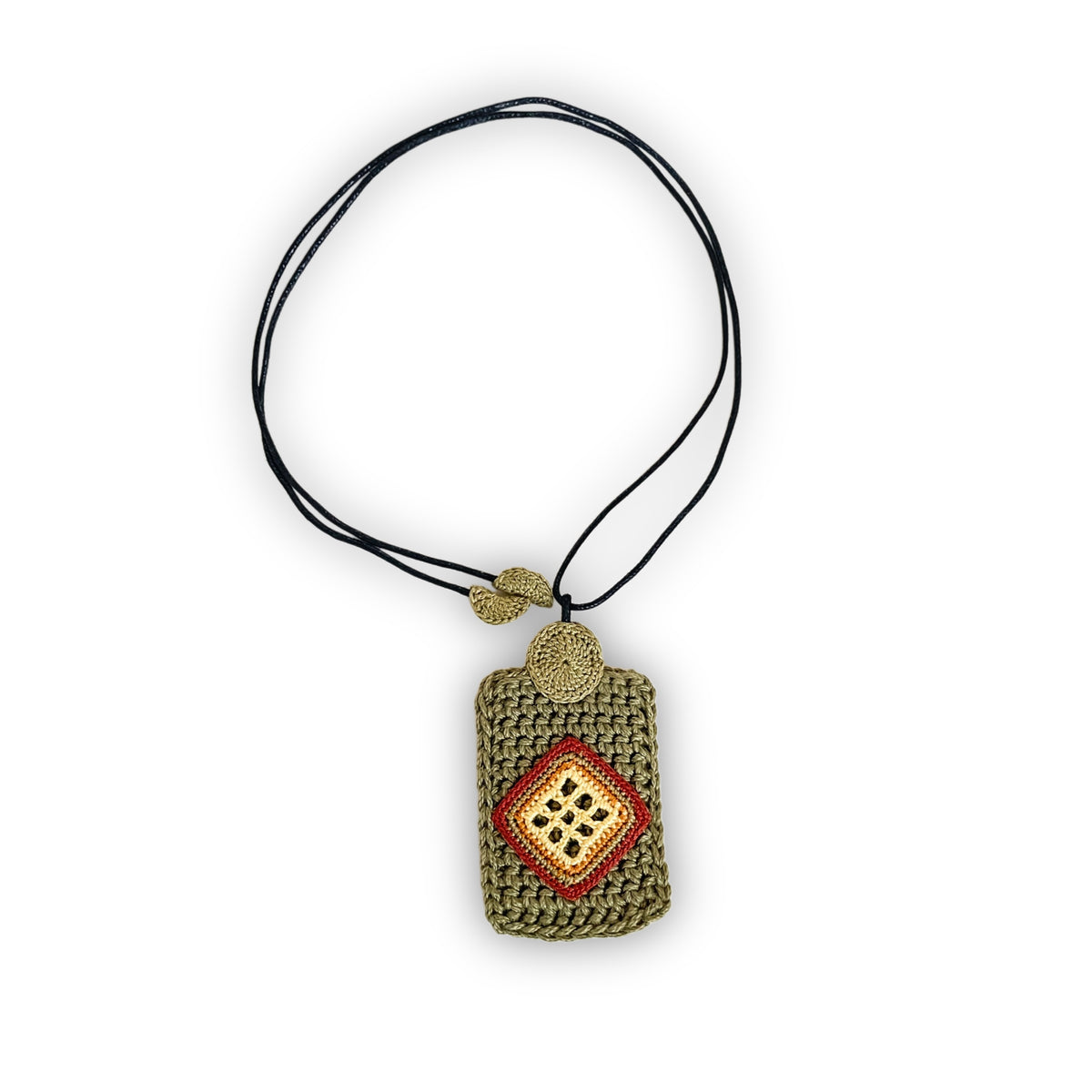 TRAMA crochet necklace with a moss green rectangular pendant, a yellow butter, ginger and clay diamond motif, and a black cord on a white background.